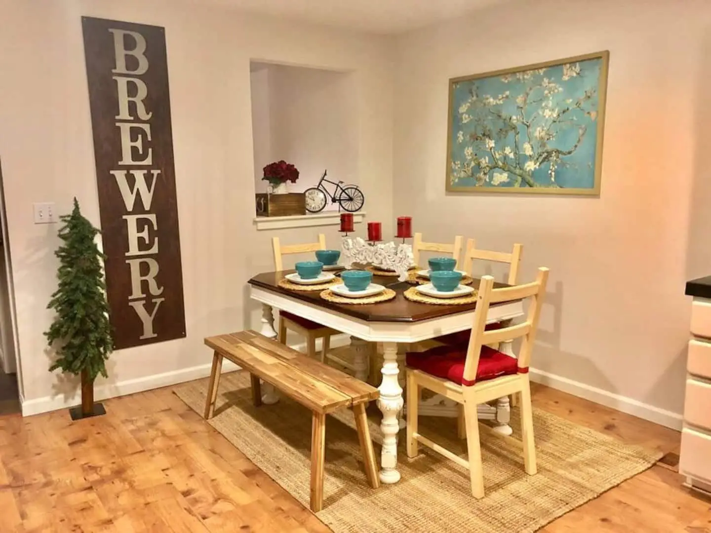 Farmhouse dining table set for six near the kitchen at Magnolia House in Bend