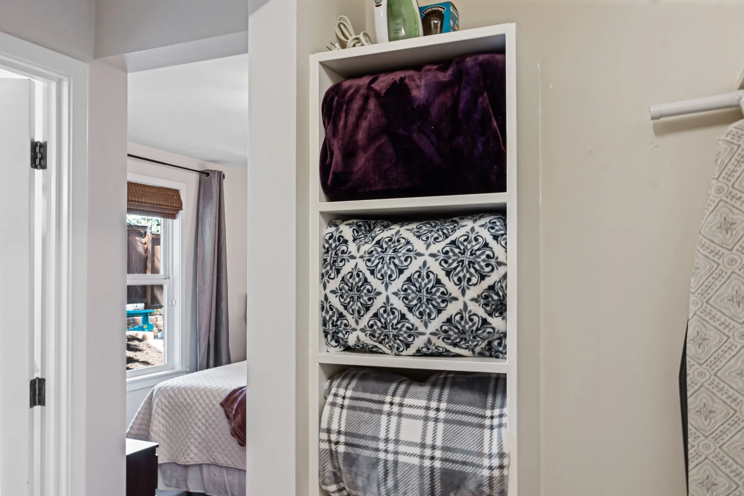 Spa robes and fresh linens stocked in the closet at Magnolia House, Bend, Oregon