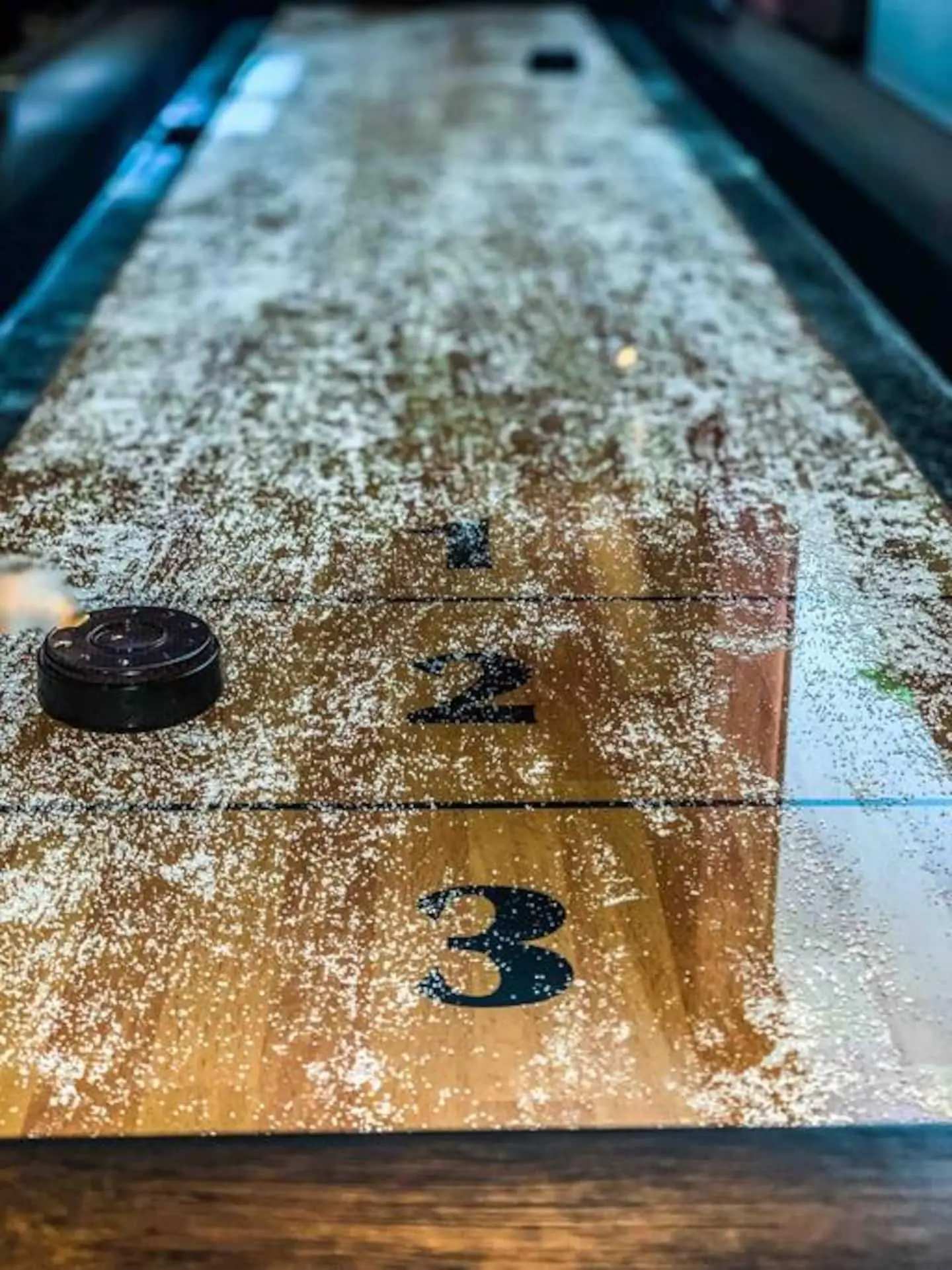 Vintage shuffleboard table ready to play at Magnolia House vacation rental in Bend